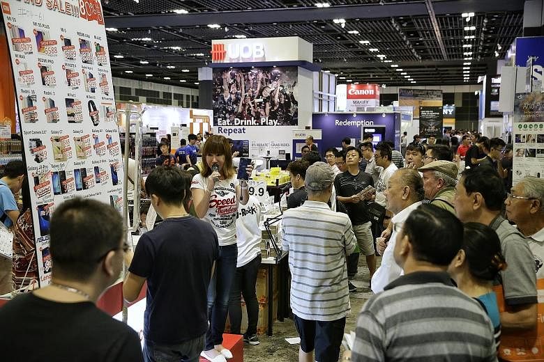 About 50,000 visitors flocked to the opening of this year's Consumer Electronics Exhibition, spread over three floors at Suntec Singapore, yesterday. Now in its fourth year, the exhibition offers discounts and promotions from top tech brands and telc