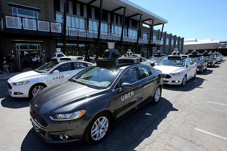A fleet of Uber's Ford Fusion self-driving cars during a demonstration of self-driving automotive technology in Pittsburgh, Pennsylvania, in September last year.