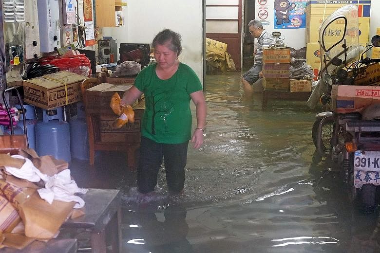 One of the many homes deluged by flood waters in Jinshan district in New Taipei City yesterday after torrential rain swept through the island.
