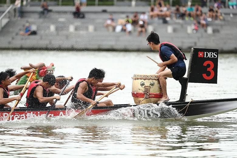 Rowers from the Nanyang Junior College dragon boat team racing to win the boys' DB22 200m race on the second day of the DBS Marina Regatta yesterday. The regatta will continue over the weekend at The Promontory along Marina Bay with races in the 500m