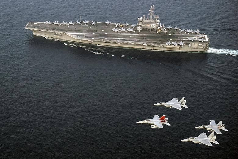 US Navy and Japan Air Self-Defence Force aircraft flying over USS Ronald Reagan in the Sea of Japan (East Sea) last Thursday. US Secretary of Defence James Mattis highlighted the threat that North Korea's nuclear weapons posed to the region, and call