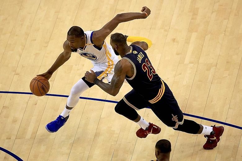 Golden State Warriors' Kevin Durant driving to the basket, past LeBron James of the Cleveland Cavaliers in Game One. The Cavs defence have to stop danger man Durant from making uncontested dunks and leaving him wide open, or Game Two will go the same