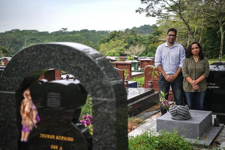 Above: Mr Sandeep Singla and his wife Neha Wilson at the grave of their late daughter Zarouhi (left).