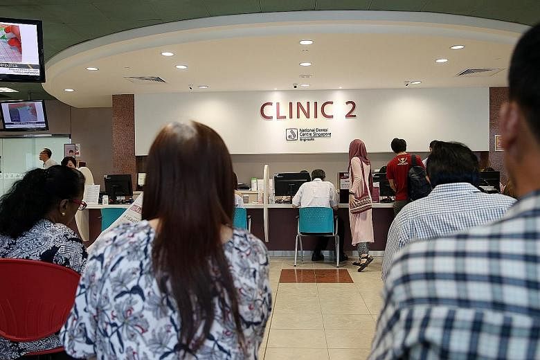 Patients waiting at a clinic at the National Dental Centre last Friday. Demand for subsidised dental care has grown, with the centre handling 160,849 patient attendances last year alone.