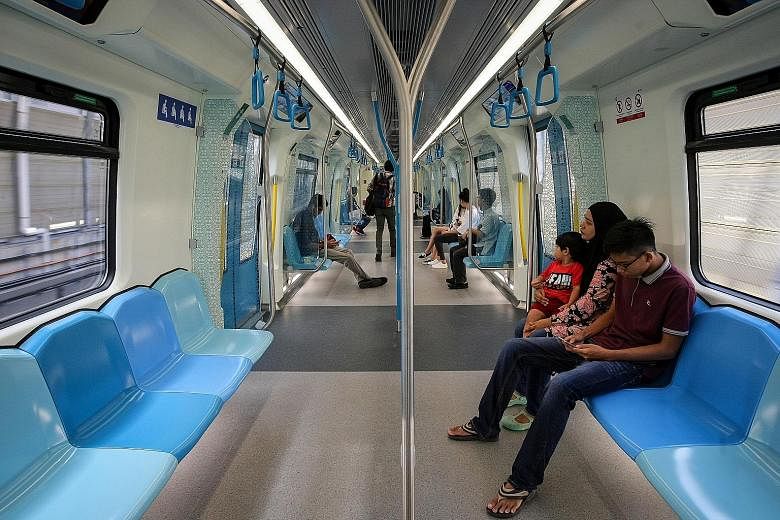 Passengers on an MRT train in Kuala Lumpur. The system and the Light Rail Transit have been expanded in recent years. The PR1MA scheme is targeted at first-time home owners with household income from RM2,500 to RM15,000. Since BR1M started in 2012, a