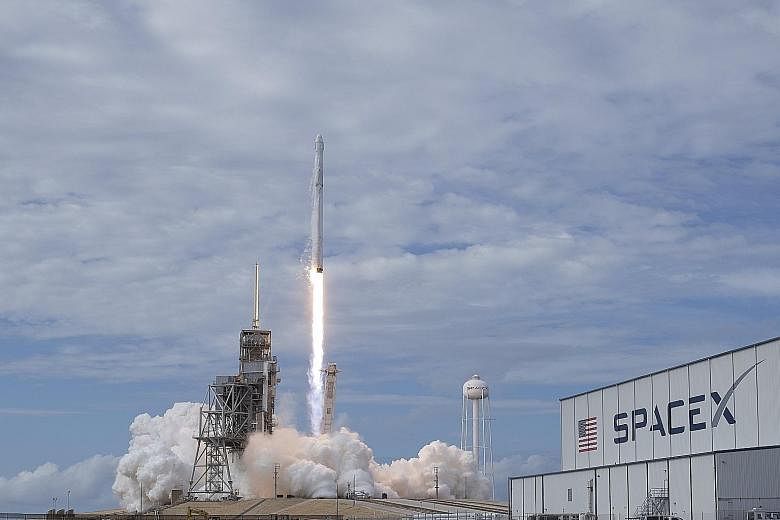 A Nasa photo showing SpaceX's Falcon 9 lifting off with the Dragon capsule from the Kennedy Space Centre on Saturday. Reusability is now seen as the key to affordable space missions.