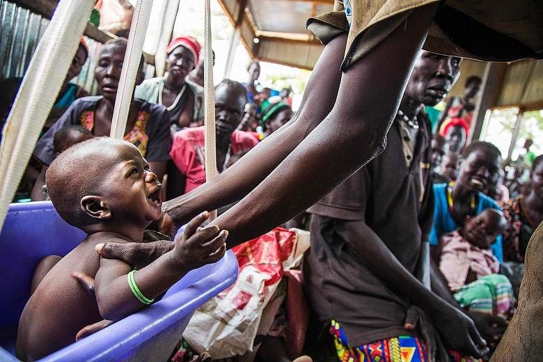 A malnourished child in a nutrition centre run by the International Rescue Committee in Panthau, Northern Bahr al Ghazal, South Sudan, one of the four countries facing massive hunger crises.