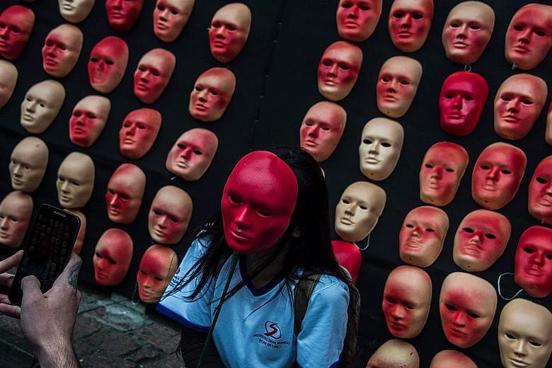 Masks representing Brazil's 594 congressmen and President Michel Temer put up as a protest against political corruption at the Museum of Art in Sao Paulo, Brazil.