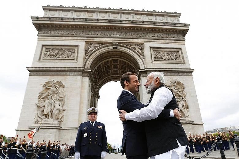 French President Emmanuel Macron and Indian Prime Minister Narendra Modi at the Arc de Triomphe last Saturday as Mr Modi ended a two-day visit to France.