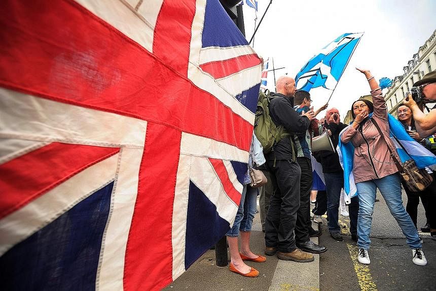 The Union flag playing a large role at a march in Glasgow. Some voters are becoming upset at Scottish National Party leader Nicola Sturgeon's insistence on a second independence referendum. Ms Sturgeon (top left) with the candidate for the Paisley co