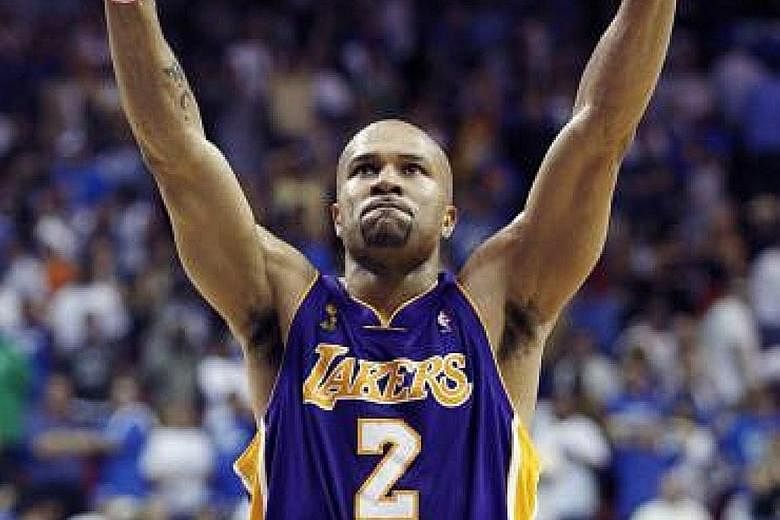 Former LA Lakers guard Derek Fisher in happier times, celebrating his ex-team's 99-91 win in overtime over the Orlando Magic to seal Game Four of the 2009 NBA Finals, which they went on to win.