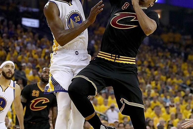 Kevin Durant of the Golden State Warriors blocking Channing Frye of the Cleveland Cavaliers in Game Two of the NBA Finals series. Durant, who ran the floor and defended the rim, had a game-high 33 points in his side's 132-113 victory.