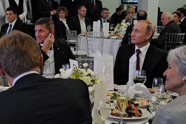 Russian President Vladimir Putin (right) with Mr Michael Flynn at the anniversary gala for television network Russia Today in Moscow in 2015.