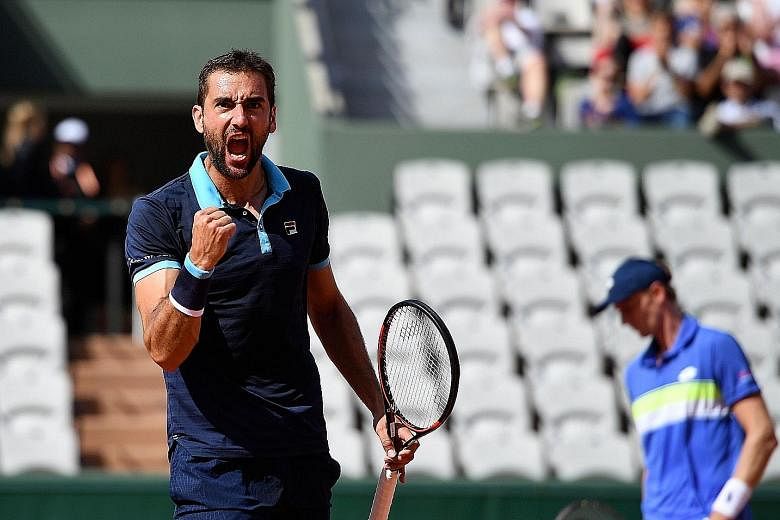 A pumped-up Marin Cilic during his match against Kevin Anderson in the round of 16 on Monday. The seventh seed was leading 6-3, 3-0 when the South African retired.