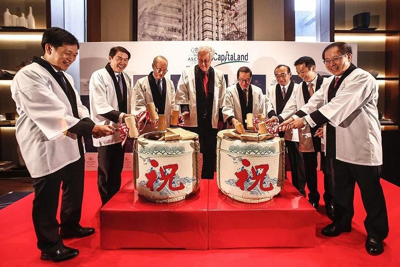 CapitaLand yesterday marked the launch of Ascott Marunouchi Tokyo with a sake-barrel opening ceremony, officiated by Emeritus Senior Minister Goh Chok Tong. He was joined by (from left) Mr Kevin Goh, chief operating officer, Ascott; Mr Lim Ming Yan, 
