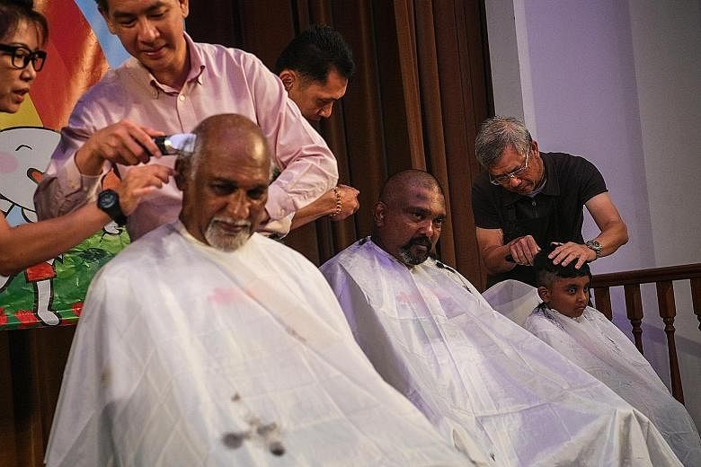 "A family that shaves together, stays together," said ComfortDelGro cabby Kanapathy Shunmugam (far left), 65, seen here with his brother Ponnappon Sathiyaverthan, 46, and nephew Matsyendra, seven. 	Mr Shunmugam's wife, daughter, son-in-law and grands
