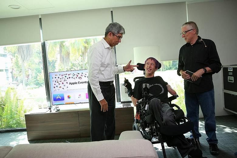 Dr Yaacob Ibrahim with Mr Christopher Hills and his father Garry, who held a workshop on tech tools to help people with disabilities.