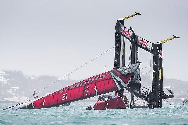 Team New Zealand's boat capsizes at the start of the America's Cup Challenger Play-offs semi-finals. Competing against Britain's Land Rover BAR in Bermuda, the Kiwis were heading to the start line when strong winds forced the boat to plunge into the 