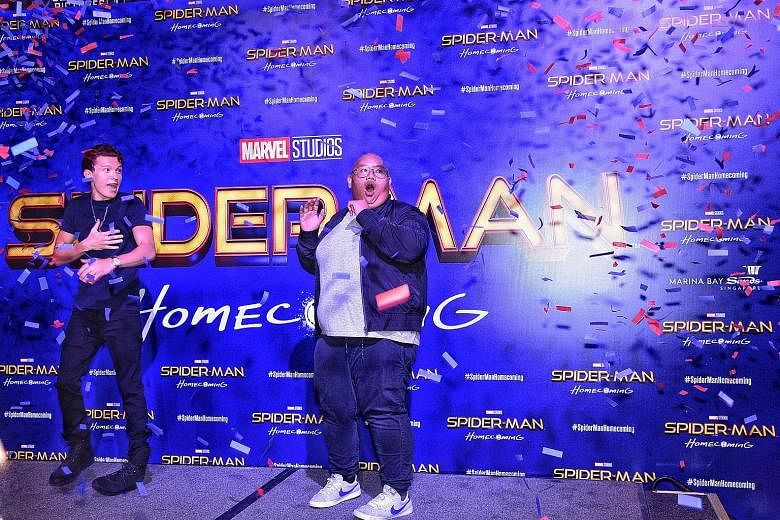 Actors Tom Holland (far left) and Jacob Batalon at the red carpet event for Spider-Man: Homecoming at the ArtScience Museum.