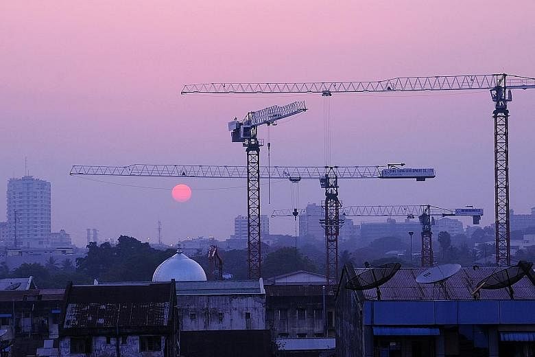 Construction work in Yangon. IE Singapore and the Myanmar Investment Commission signed an agreement yesterday which will help Singapore companies to explore business openings in Myanmar. ST FILE PHOTO