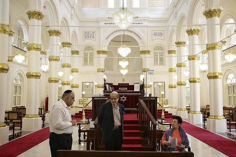 The Chesed-El Synagogue will have its maintenance and restoration works co-funded this year. In the synagogue's prayer hall are (from far left) Mr Sol Solomon, who provides administrative support to Chesed-El; Mr Sam Sassoon, chairman of the board of