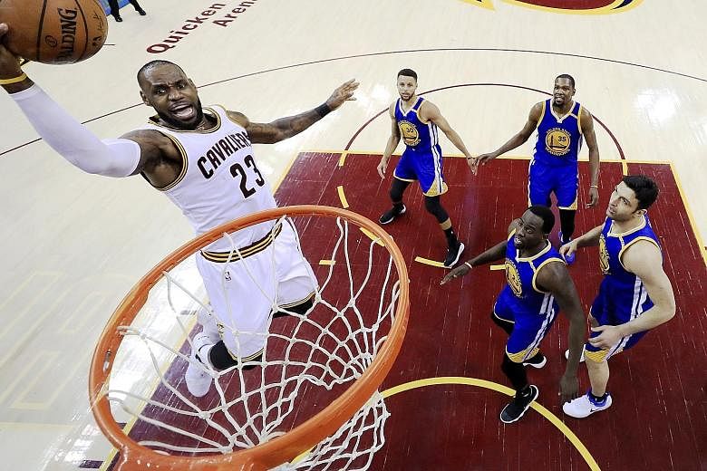 Cleveland Cavaliers forward LeBron James driving to the basket against the Golden State Warriors in Game Three of the NBA Finals. James finished with 39 points, but that effort was not enough as the Warriors held out to take a 3-0 lead in the champio