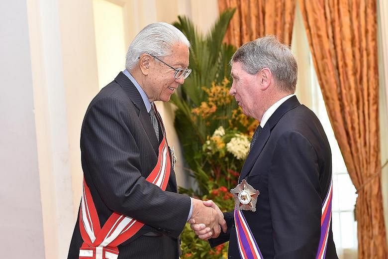 Former Australian secretary of defence Dennis James Richardson received Singapore's highest military award, the Darjah Utama Bakti Cemerlang (Tentera), at the Istana yesterday. President Tony Tan Keng Yam presented him with the award, also known as t