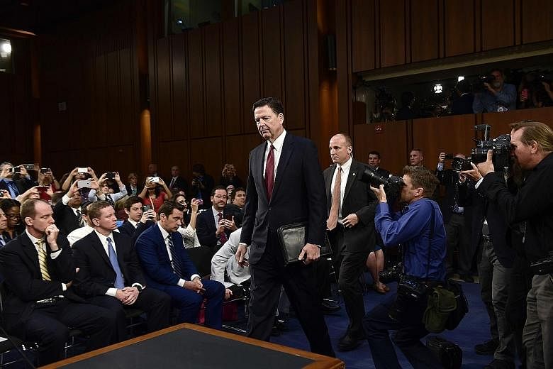 Mr James Comey was the consummate government man in his black suit and pristine white shirt with its barrel cuffs and point collar.
