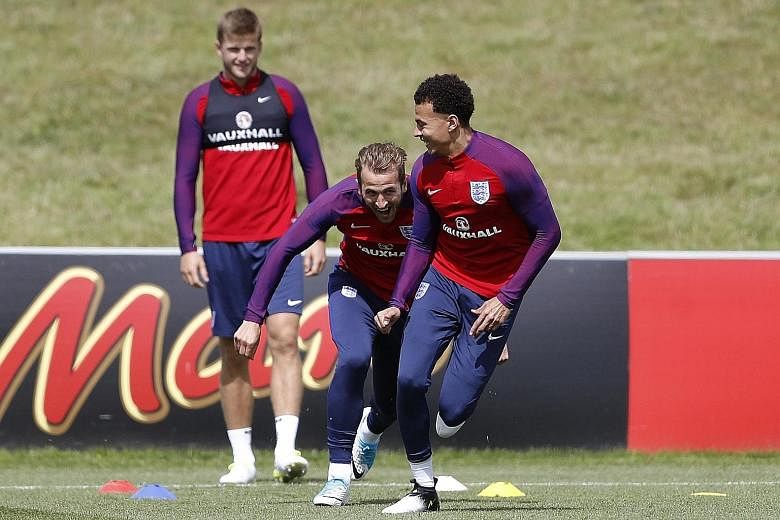 England's Harry Kane having a lighter moment with club team-mate Dele Alli (right) ahead of today's World Cup qualifier against old foes Scotland. The England striker, coming off a second season in which he won the Premier League's Golden Boot, will 