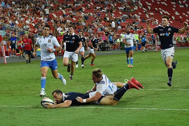 Scotland winger Tim Visser scoring a try against Italy, one of five the Scots made at the National Stadium, along with three conversions and a penalty.