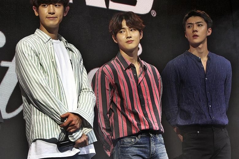 South Korean boyband EXO members (from left) Chanyeol, Suho and Sehun at Skechers' Sweet Monster K-pop dance competition at Causeway Point.