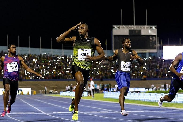 Usain Bolt salutes the crowd after winning the 100m "Salute to a Legend" race at the National Stadium in Kingston, Jamaica. The eight-time Olympic gold medallist will retire in August after competing in his last meet, the World Championships in Londo