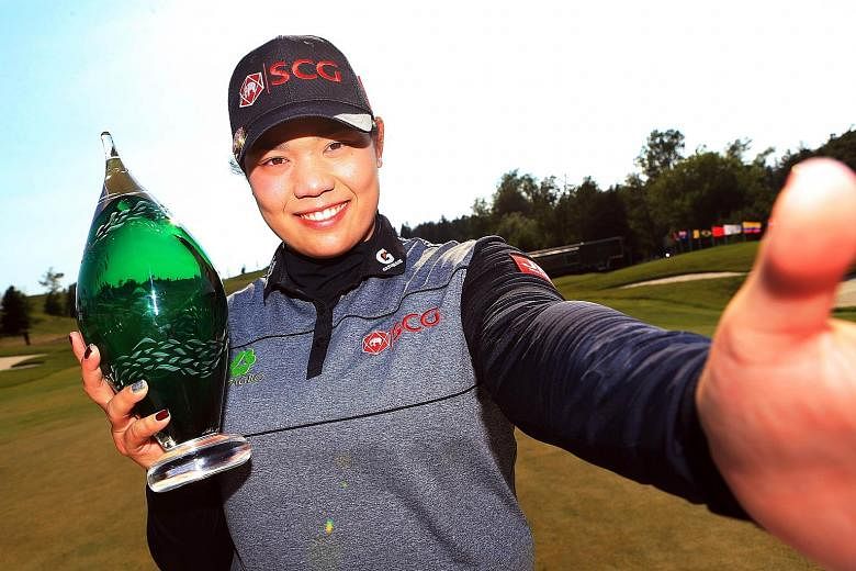 Ariya Jutanugarn of Thailand mimics taking a selfie after sinking a birdie putt on the first play-off hole to win the Manulife LPGA Classic at Whistle Bear Golf Club, her first title of the year.