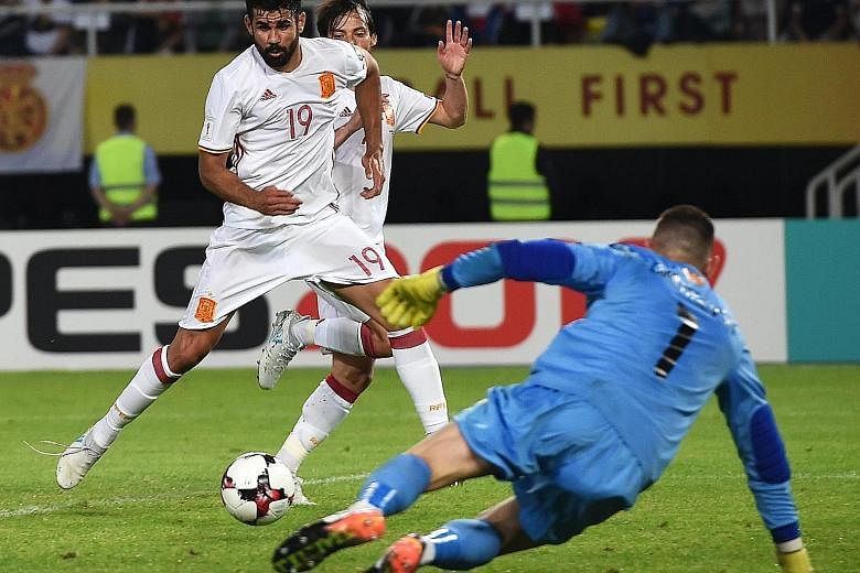 Spain striker Diego Costa (No. 19) scoring the winner in their 2-1 away win over Macedonia to stay top of Group G. With a goal difference of four separating Spain and Italy, their crunch Sept 2 clash at the Santiago Bernabeu promises to be a cagey af