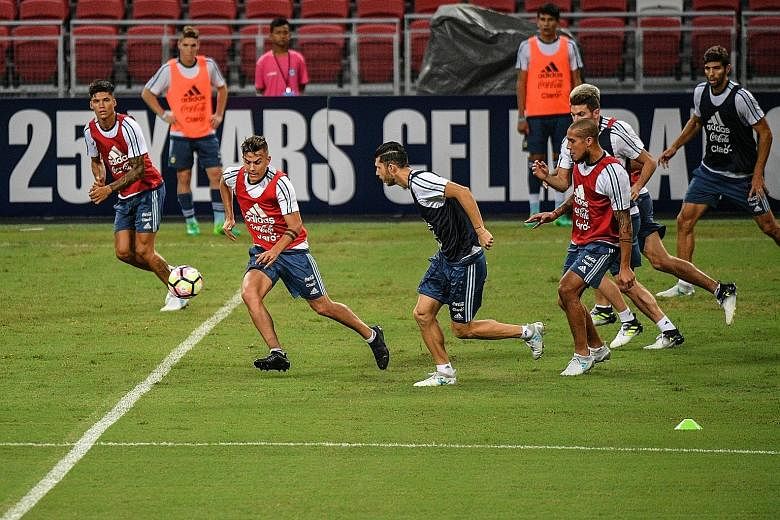 Paulo Dybala, second from left, at a training session last night. Argentina coach Jorge Sampaoli spoke very briefly yesterday but refused to underestimate the Lions.