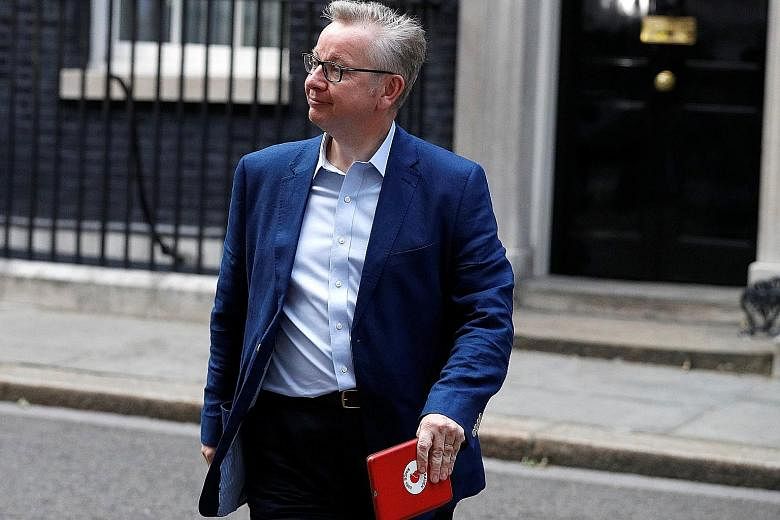 Mrs May has given former adversary Michael Gove a role in her Cabinet, after firing him last year. After last Thursday's election result, she was unable to carry out wholesale Cabinet changes mooted before the election. British PM Theresa May (centre