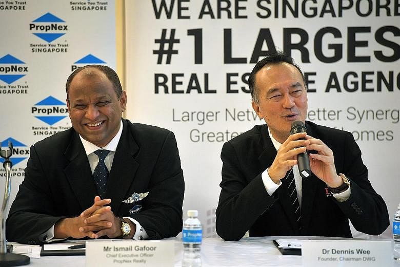 PropNex Realty chief executive Ismail Gafoor and Dennis Wee Group founder and chairman Dennis Wee at the press conference yesterday. Mr Wee said the group has been fielding acquisition offers for three years, but Mr Ismail struck him as the "most sin