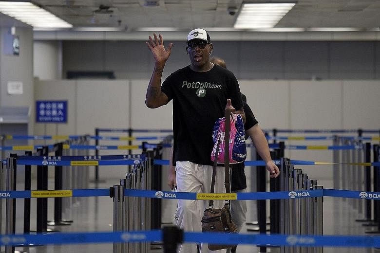 Former NBA basketball player Dennis Rodman preparing to check in for his flight to North Korea at Beijing's international airport yesterday. The flamboyant star has made at least four previous visits to Pyongyang, most recently in 2014.