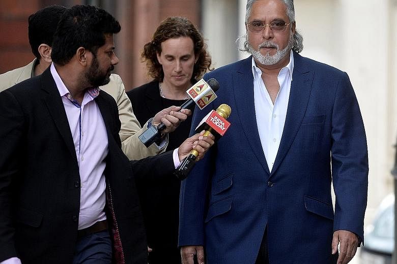 Mr Vijay Mallya arriving for an extradition hearing at a London court yesterday. He fled India last year owing more than S$1.38 billion after defaulting on loan payments to state-owned banks.