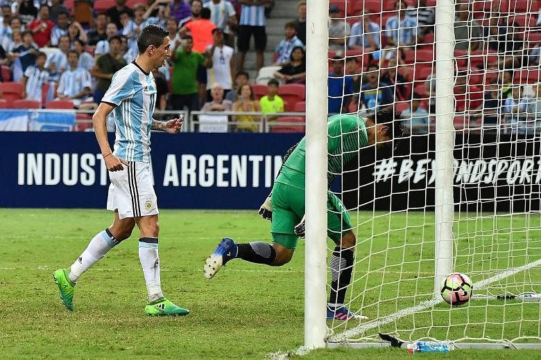 Singapore goalkeeper Izwan Mahbud failing to save the tap-in from Angel di Maria as the Lions conceded six goals at the National Stadium against Argentina.
