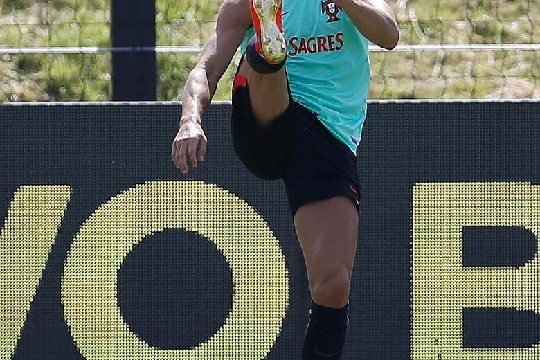 Cristiano Ronaldo at a training session in Oeiras, Portugal, yesterday in preparation for the Confederations Cup in Russia. Spanish prosecutors have accused the Real Madrid star of defrauding the authorities of millions of euros in tax.