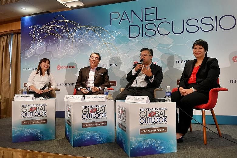 (From left) The Straits Times foreign editor and forum moderator Audrey Quek, Singapore's Ambassador-at-Large Ong Keng Yong, Merdeka Centre director Ibrahim Suffian and OCBC Bank head of Treasury Research and Strategy Selena Ling at yesterday's panel