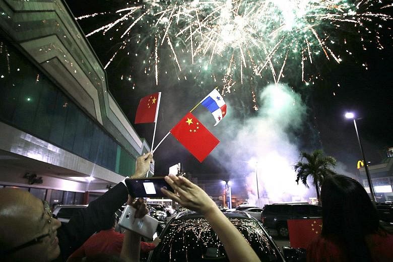 Fireworks seen over the skies on Monday night in Panama City, the capital of Panama, where the Chinese community celebrated news of the establishment of formal diplomatic ties between China and Panama.