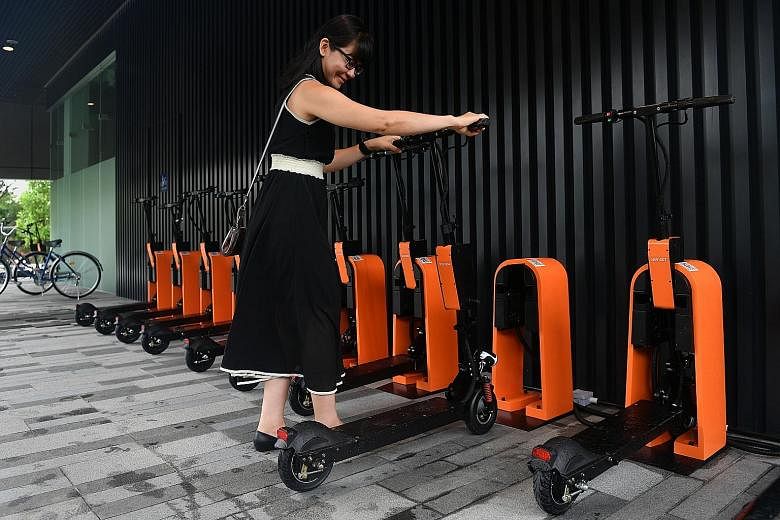 A docking station for e-scooters at Singapore Science Park 1. The devices can be located and unlocked using an app.