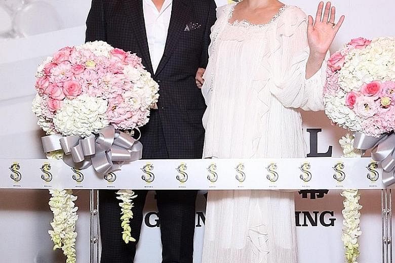 Actress Barbie Hsu and her husband, businessman Wang Xiaofei, at the opening of S Hotel in Taipei on Tuesday.