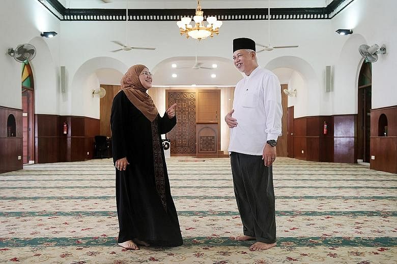 Mr Yusoff Ali, chairman of Masjid Omar Kampong Melaka, with Ms Zahra Aljunied, a fifth-generation descendant of Arab merchant Syed Omar Aljunied, who built the mosque. "This place is like home, for both me and others," she said. Masjid Omar Kampong M
