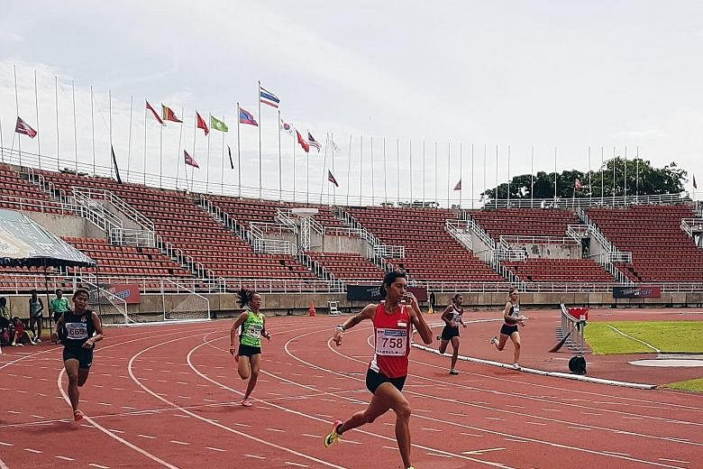 Singapore runner Dipna Lim-Prasad coming from behind to win the 400m race at the Thailand Open yesterday. Her time of 55.10sec was just shy of Chee Swee Lee's 43-year national record of 55.08sec.