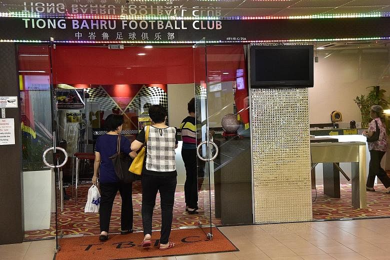 […] Patrons going into Tiong Bahru Football Club's clubhouse at People's Park Centre yesterday. [/…]It still has 29 fruit machines after a raid by the Commercial Affairs Department in April.