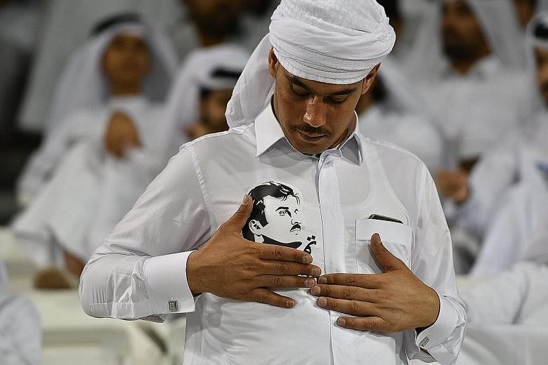 A Qatari wears his loyalty clearly with a photo of the Emir, Sheikh Tamim Hamad Al-Thani, on his shirt. The move last week by Saudi Arabia, Bahrain and the UAE to cut ties with their fellow Gulf state Qatar has resulted in confusion and consternation