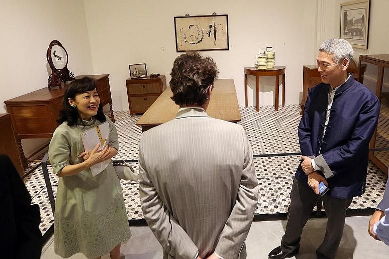 Mr Lee Hsien Yang and his wife Lee Suet Fern showing a visitor furniture and exhibits from Mr Lee Kuan Yew's house at the preview of the 2015 exhibition, We Built A Nation, at the National Museum. Mr Lee told The Straits Times yesterday that leaving 